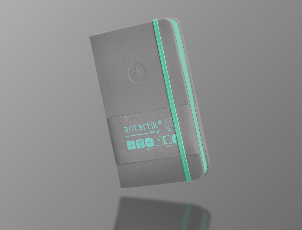 CUADERNO CON GOMILLA ANTARTIK NOTES TAPA DURA A6 HOJAS CUADRICULA GRIS Y TURQUESA 100 HOJAS 80 GR FSC