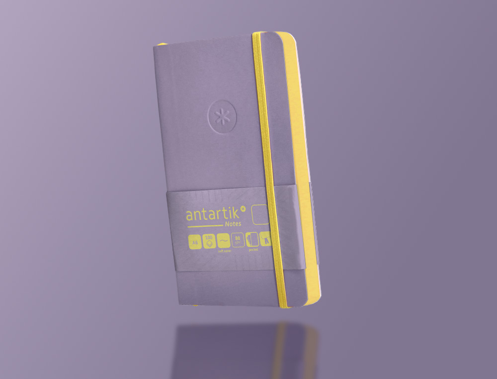 CUADERNO CON GOMILLA ANTARTIK NOTES TAPA BLANDA A6 HOJAS LISAS MORADO Y AMARILLO 100 HOJAS 80 GR FSC